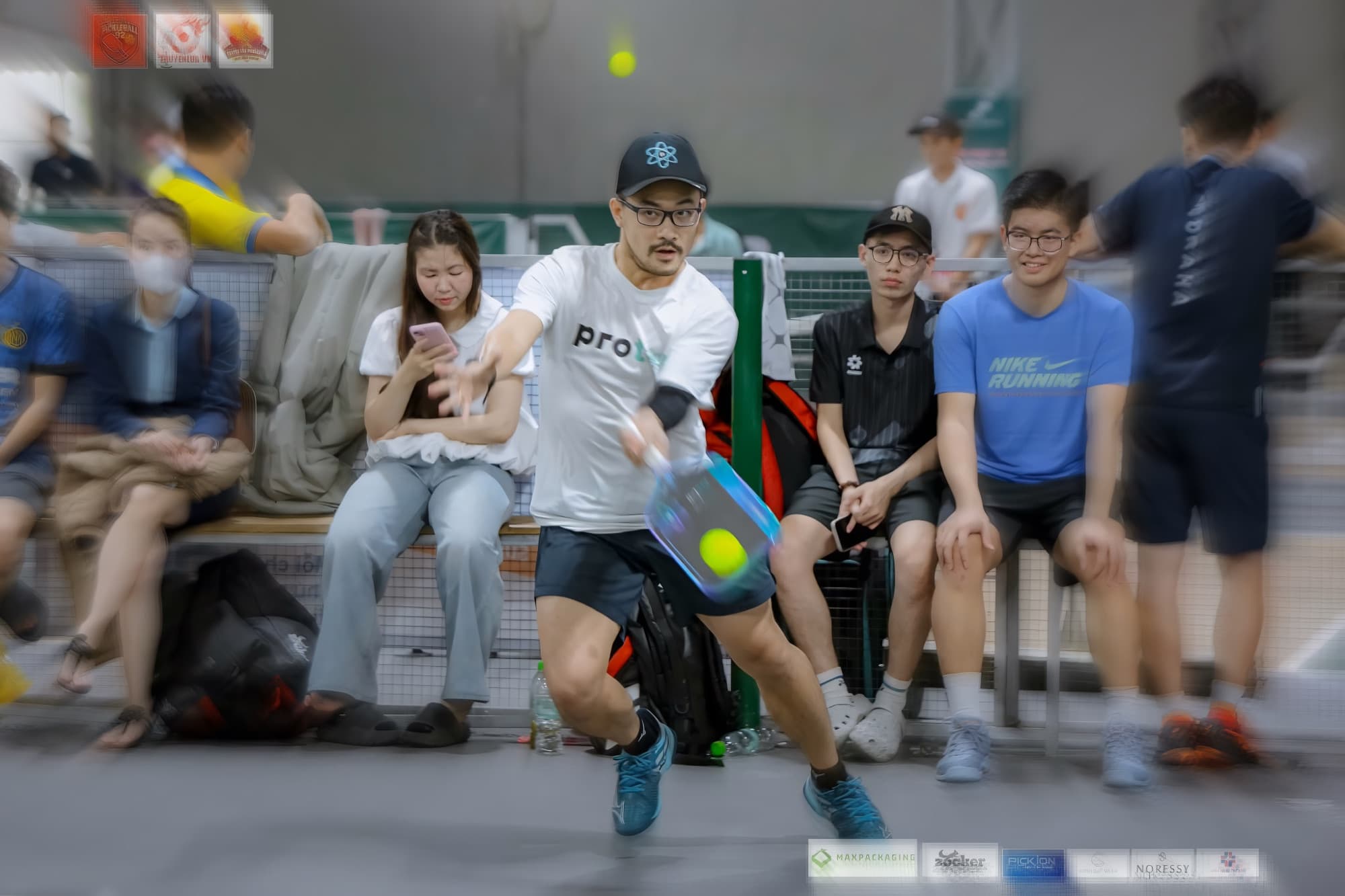 Coach Ho in fast match play at a pickleball tournament in Da Nang