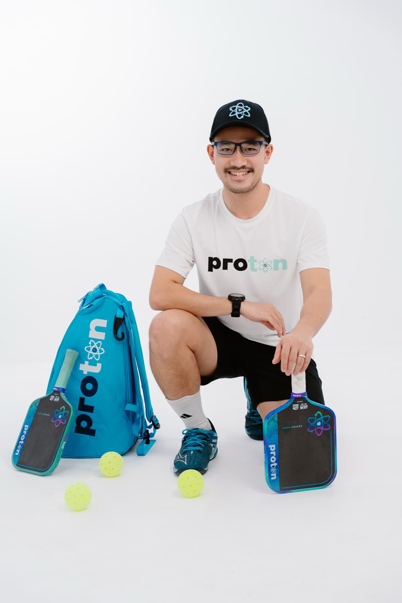 Ho Ngoc Nguyen with Proton paddles and balls, ready to coach in Da Nang