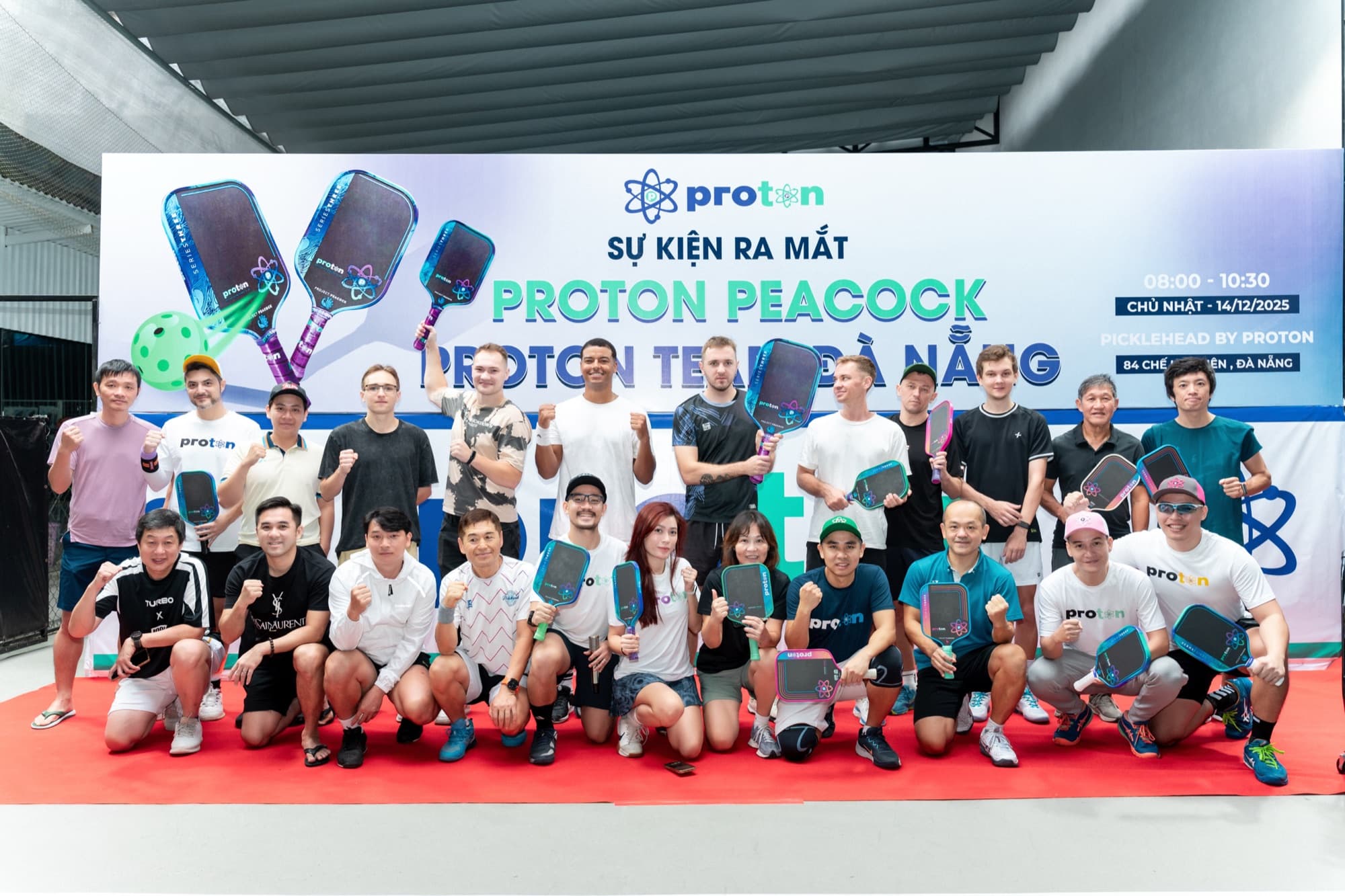Group photo at the Proton Peacock pickleball event in Da Nang